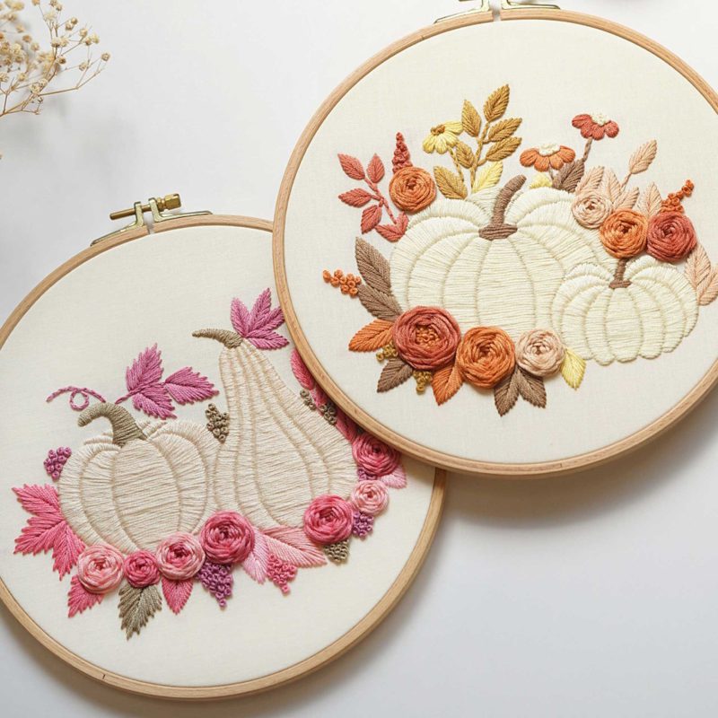 Two embroidered pumpkins