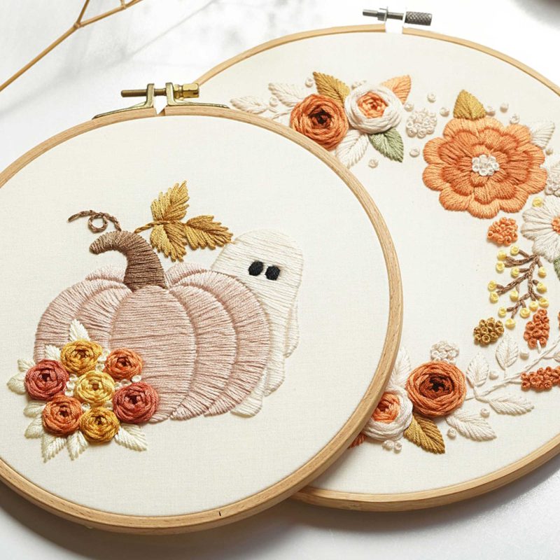 Pumpkin embroidery with a ghost hiding behind it